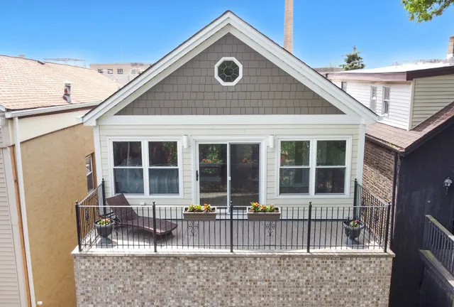 a front view of a house with a fence