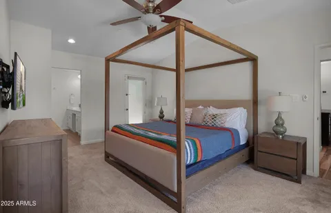 a bed room with a bed and a couch