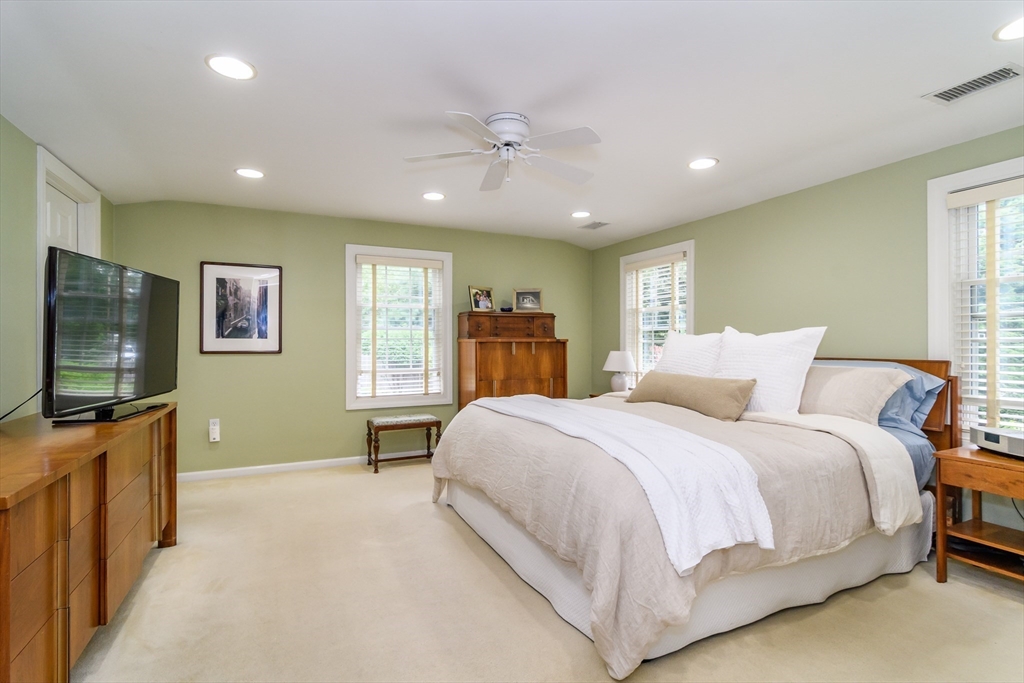 50 Felch Road Natick, MA 01760 - Photo 15 of 32 a bedroom with a large bed and a flat screen tv
