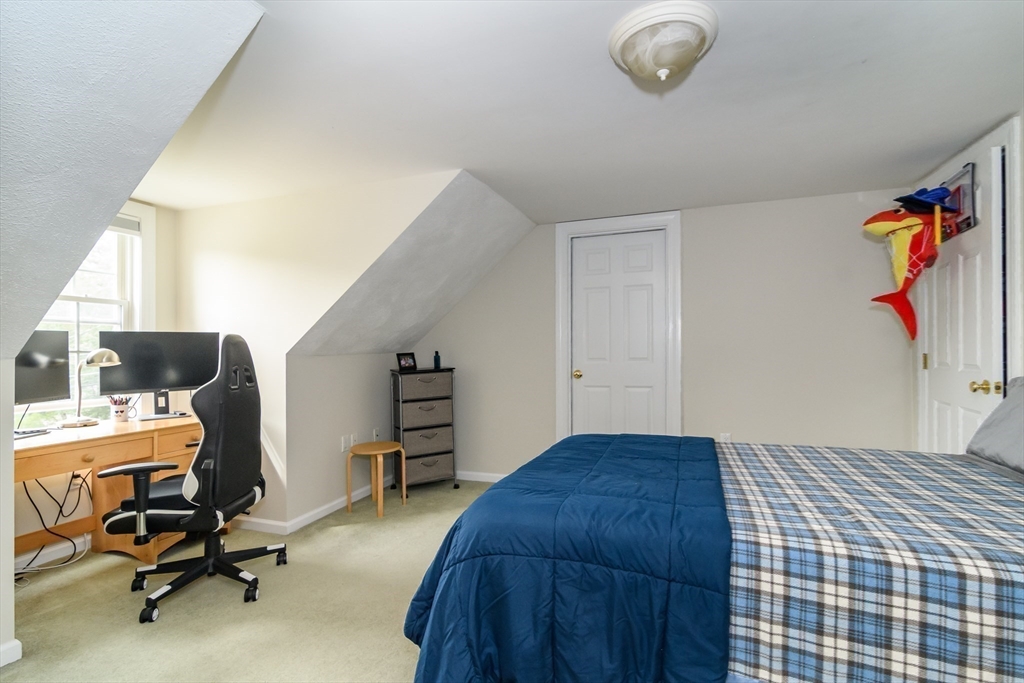 50 Felch Road Natick, MA 01760 - Photo 18 of 32 a bedroom with a workspace