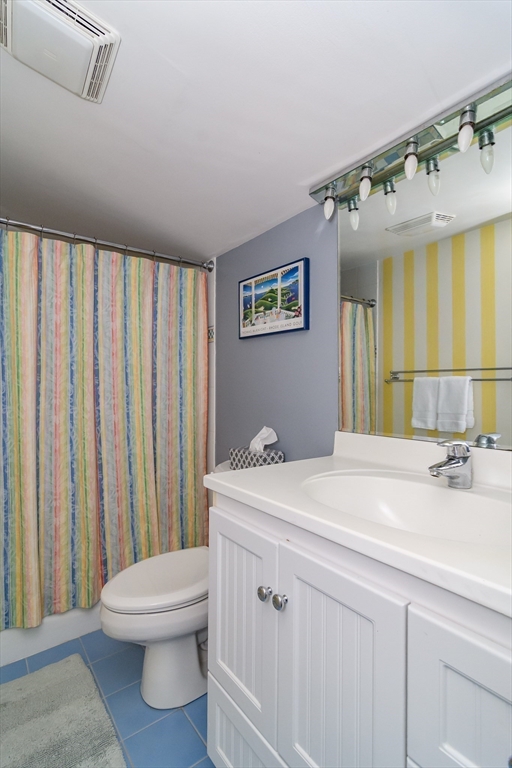 50 Felch Road Natick, MA 01760 - Photo 20 of 32 a bathroom with a sink a toilet and mirror