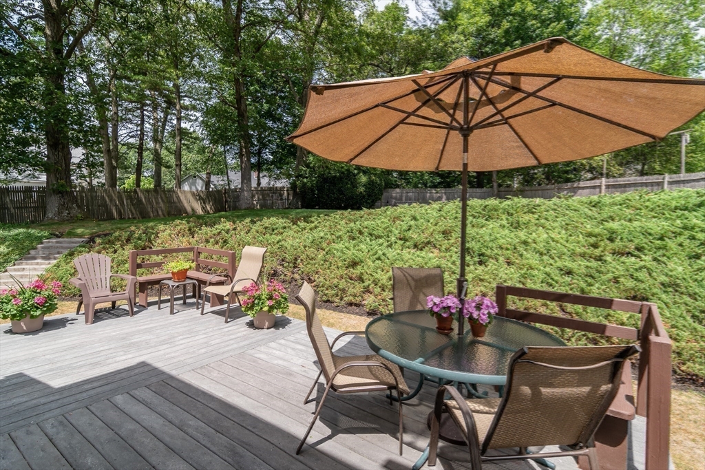 50 Felch Road Natick, MA 01760 - Photo 27 of 32 a view of backyard with seating space and wooden floor