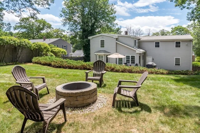 a view of a house with a yard porch and furniture