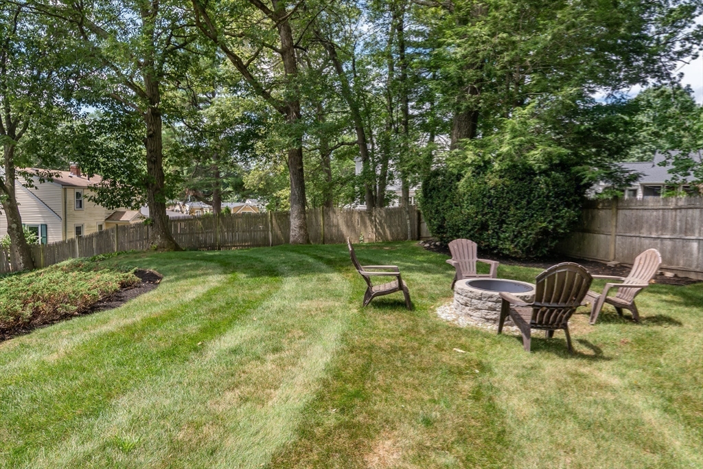 50 Felch Road Natick, MA 01760 - Photo 30 of 32 a view of a bench in a backyard
