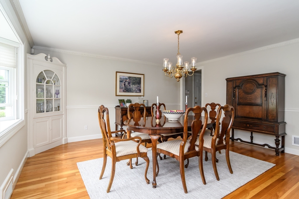 50 Felch Road Natick, MA 01760 - Photo 3 of 32 a dining room with furniture a chandelier and wooden floor