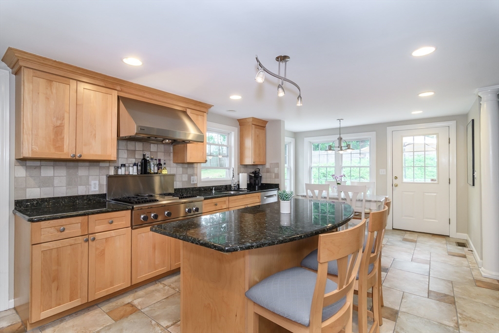 50 Felch Road Natick, MA 01760 - Photo 4 of 32 a kitchen with granite countertop a sink stainless steel appliances and cabinets