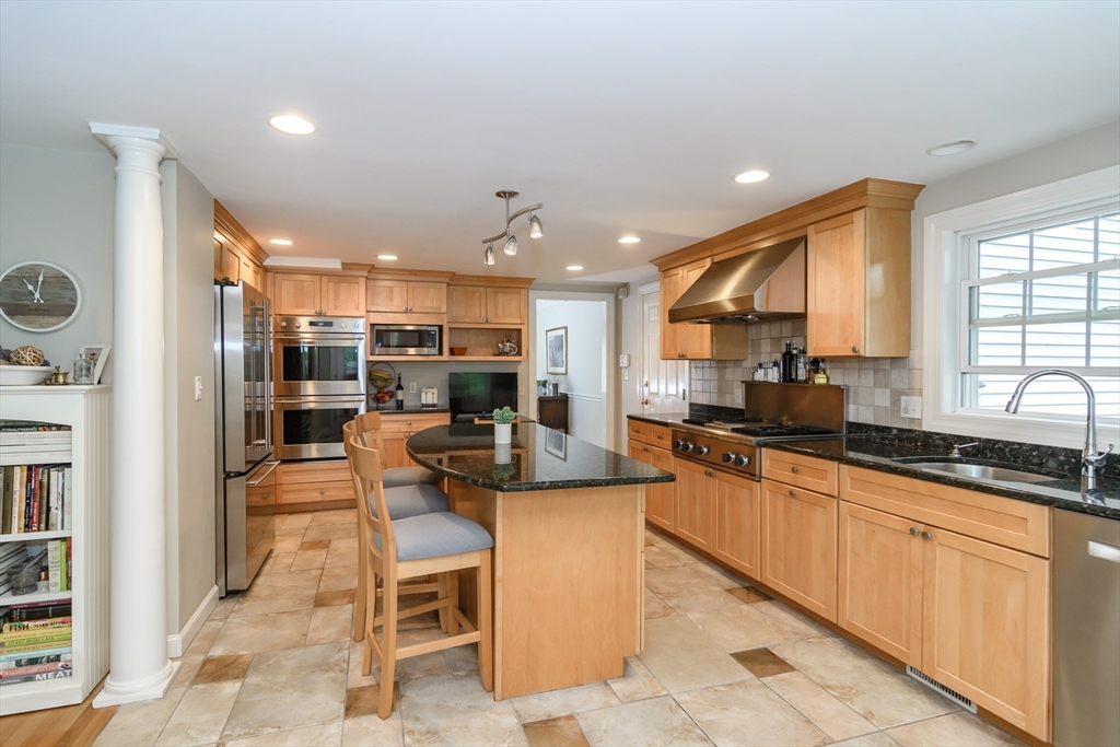 50 Felch Road Natick, MA 01760 - Photo 5 of 32 a kitchen with sink cabinets and window