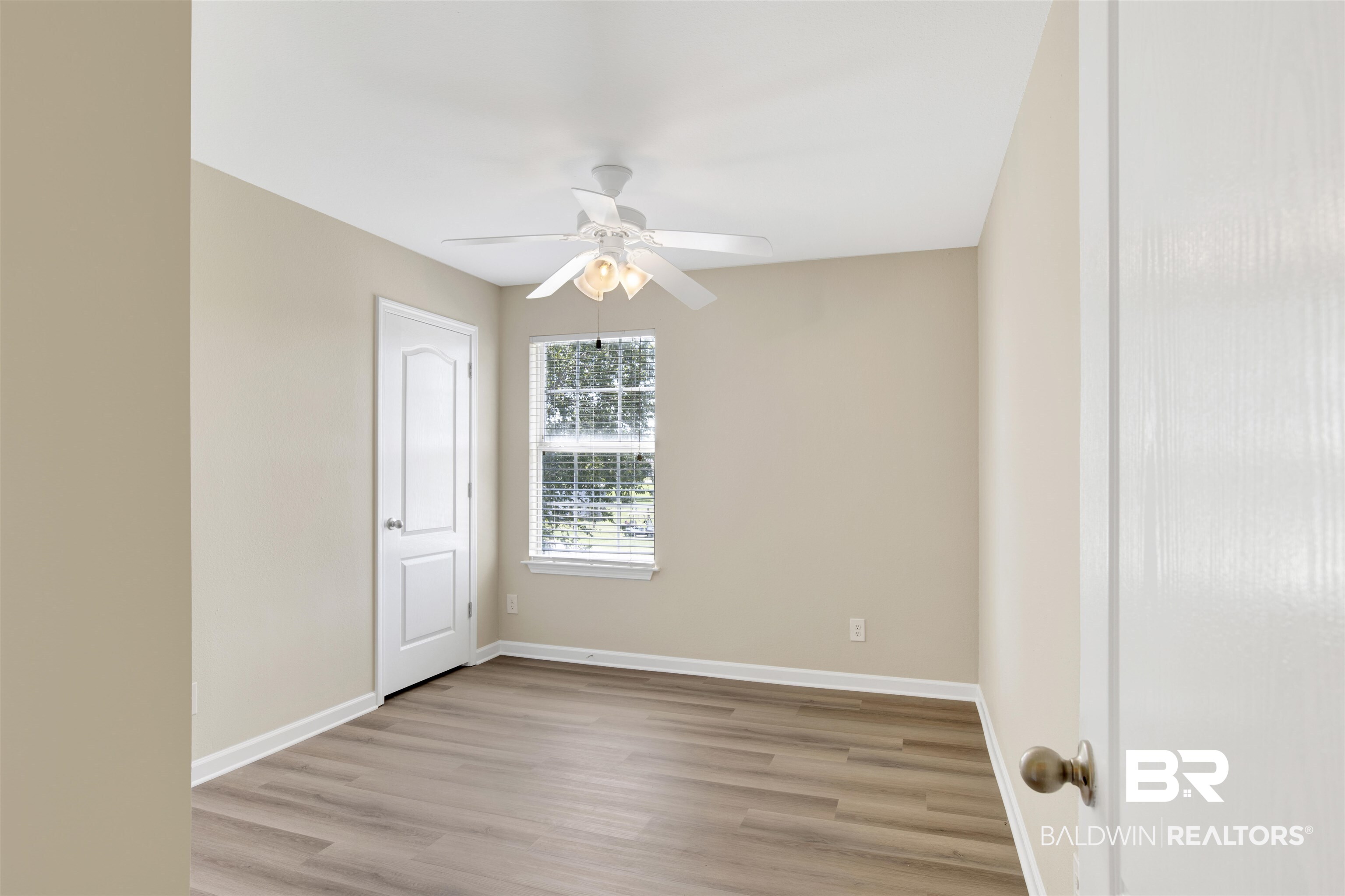 2002 Shelene Way Foley, AL 36535 - Photo 17 of 23 Spare room featuring light wood-style floors and a ceiling fan
