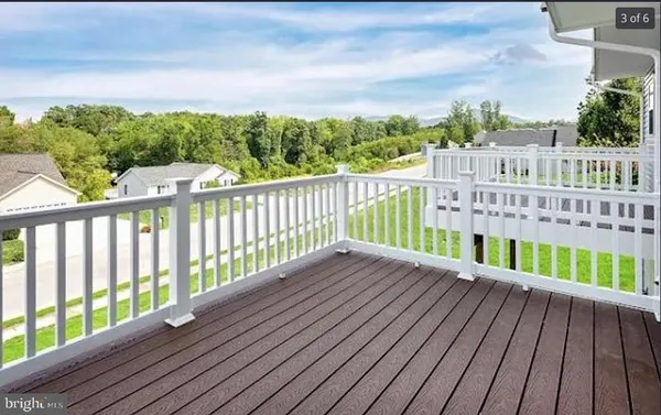 a view of a balcony with wooden floor