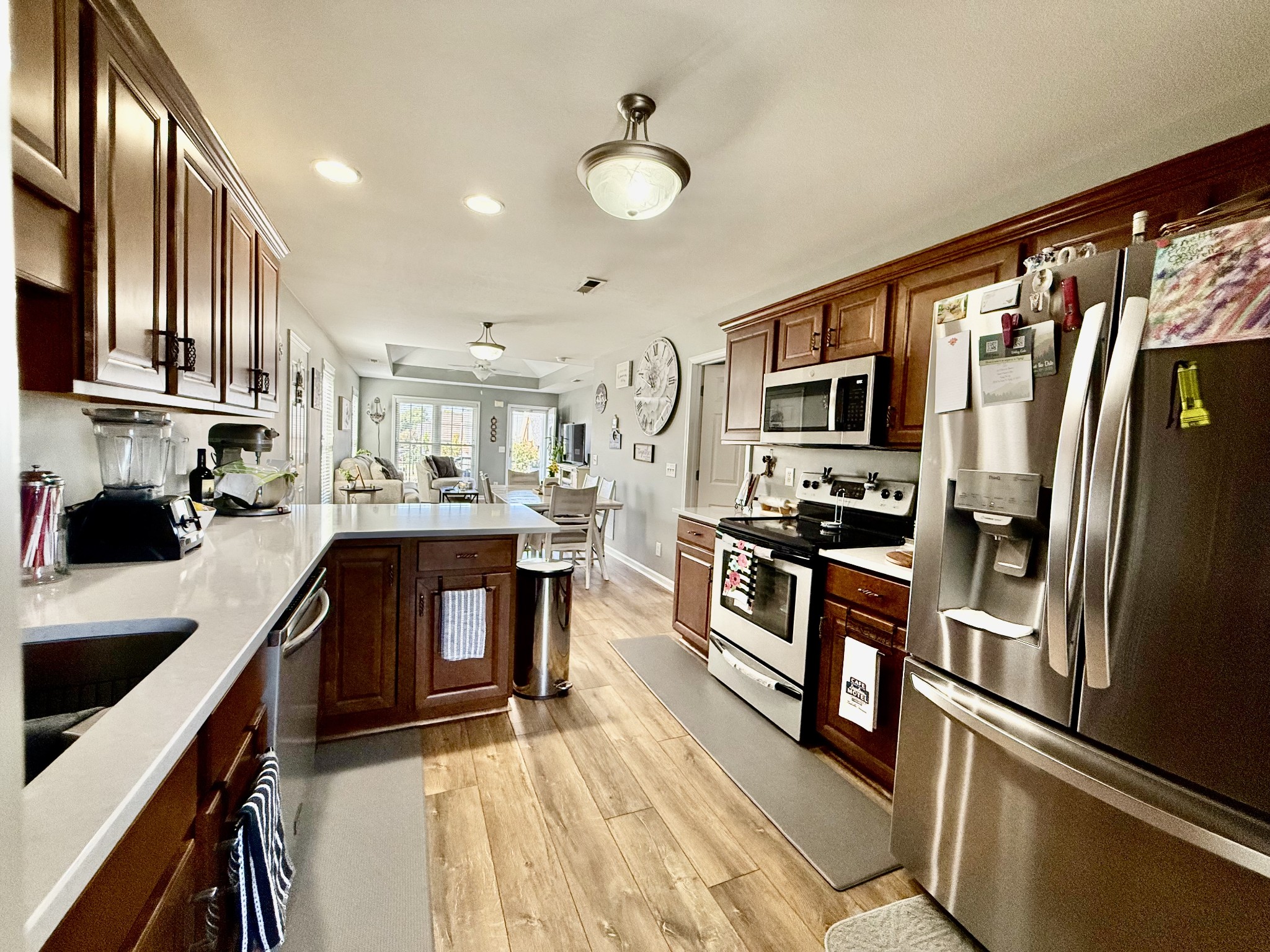 233 Winfrey Court Pleasant View, TN 37146 - Photo 11 of 28 a kitchen with stainless steel appliances sink stove microwave and cabinets