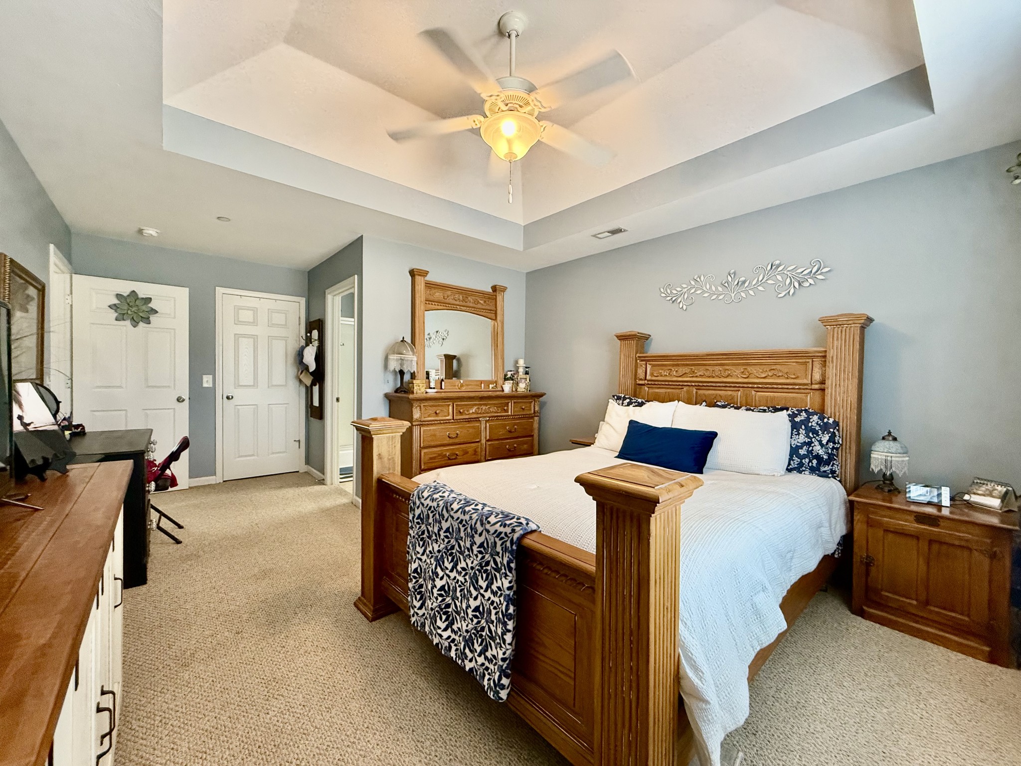 233 Winfrey Court Pleasant View, TN 37146 - Photo 17 of 28 a bedroom with bed and a chandelier