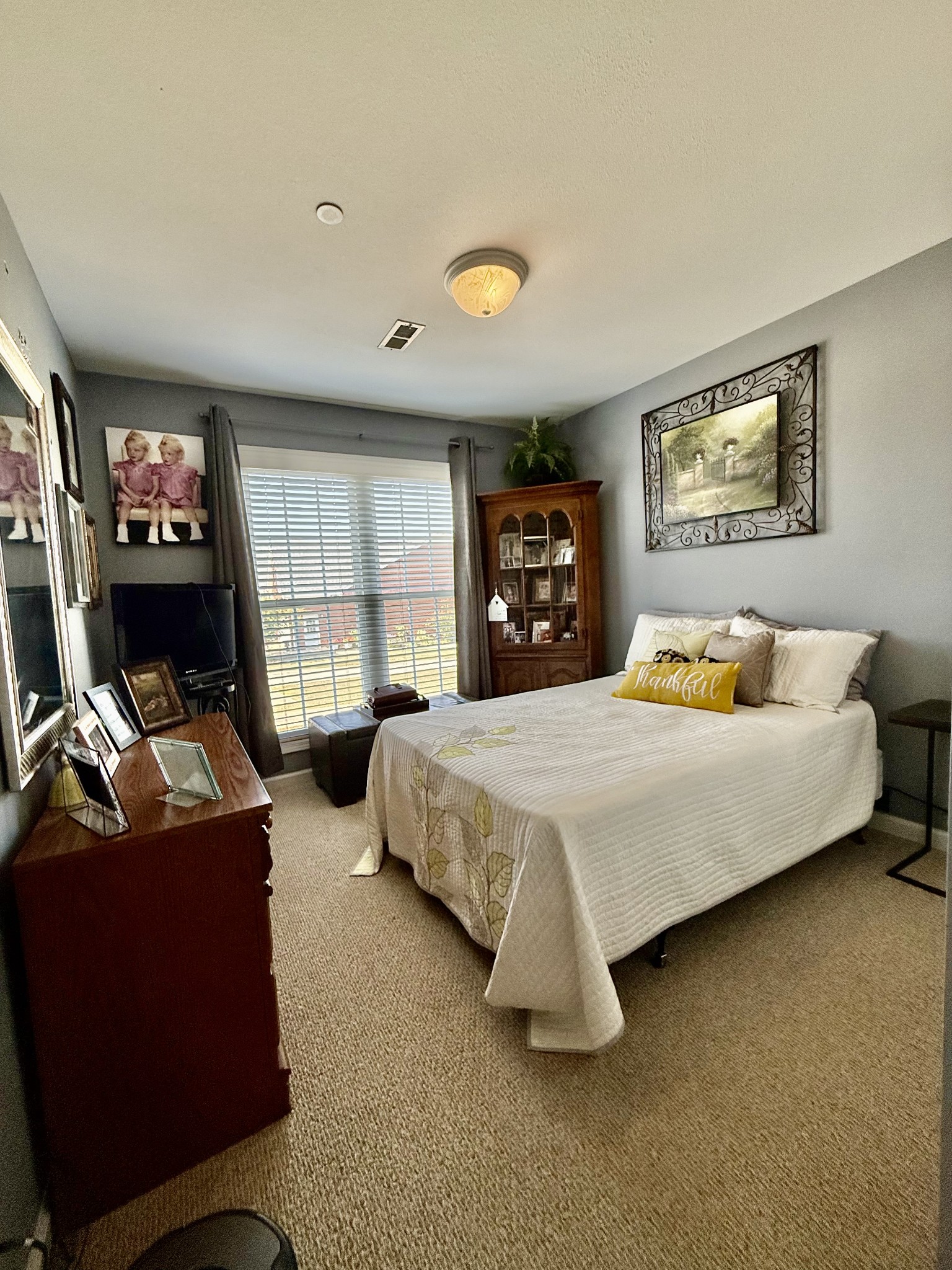 233 Winfrey Court Pleasant View, TN 37146 - Photo 19 of 28 a bedroom with a bed and dresser