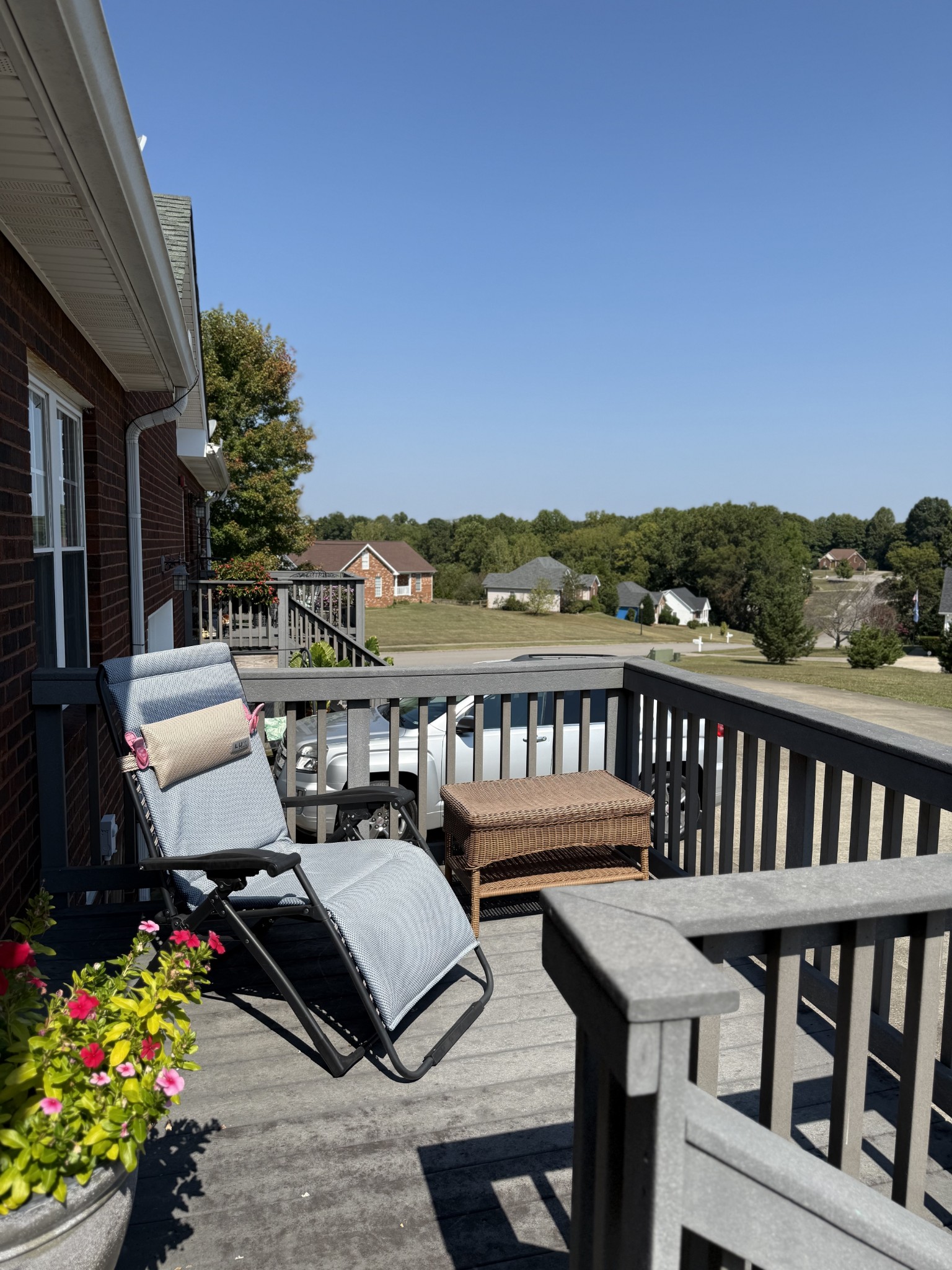 233 Winfrey Court Pleasant View, TN 37146 - Photo 25 of 28 a view of a balcony with chairs and wooden floor