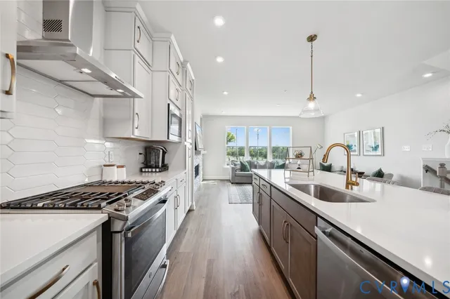 a living room with kitchen island furniture and a wooden floor
