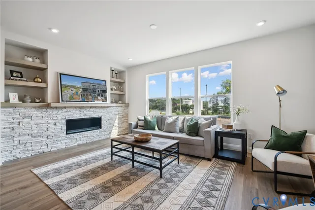 a living room with furniture and a fireplace