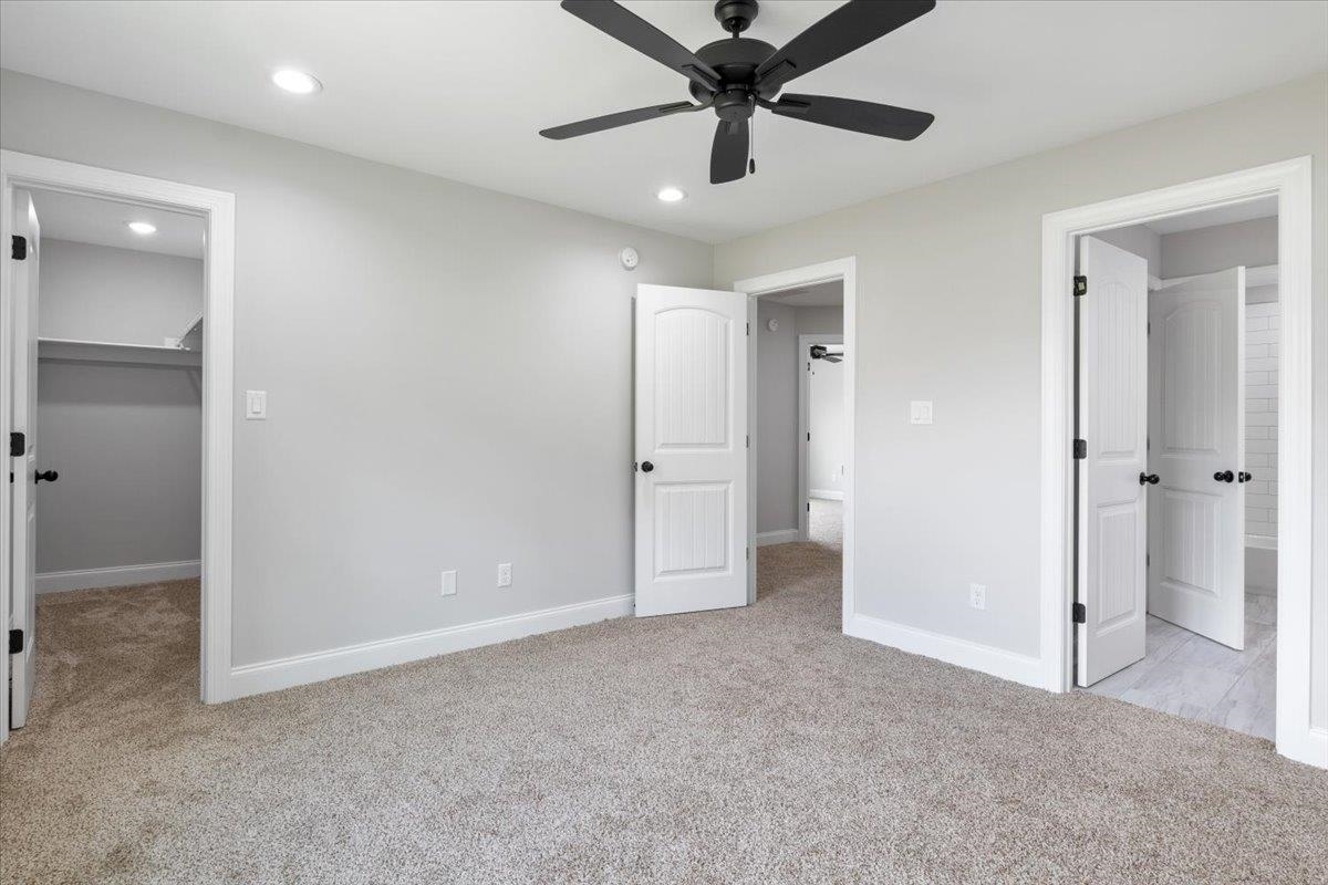 80 Fairview Trail Byhalia, MS 38611 - Photo 17 of 25 an empty room with closet and a ceiling fan