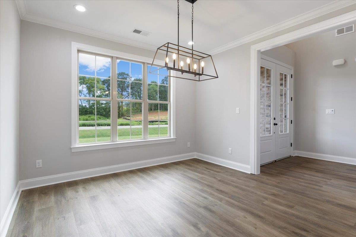 80 Fairview Trail Byhalia, MS 38611 - Photo 4 of 25 a view of livingroom with window chandelier fan and wooden floor