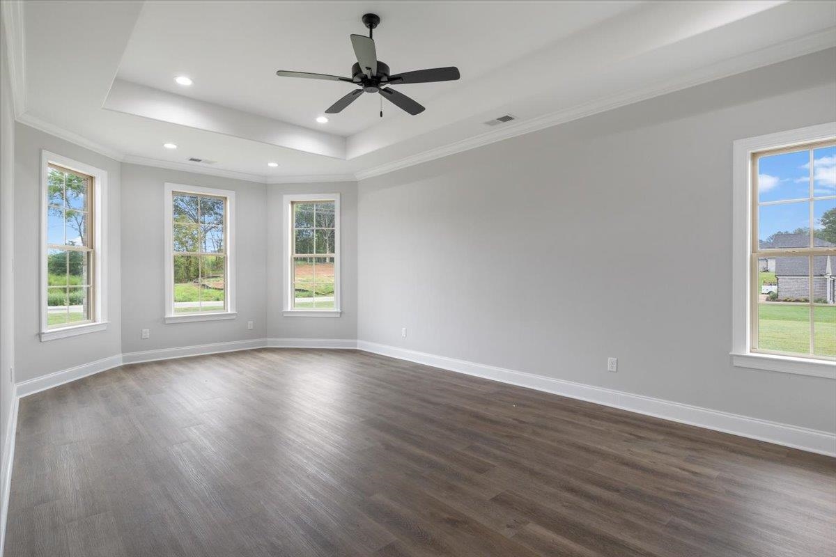 80 Fairview Trail Byhalia, MS 38611 - Photo 9 of 25 a view of an empty room with wooden floor and a window