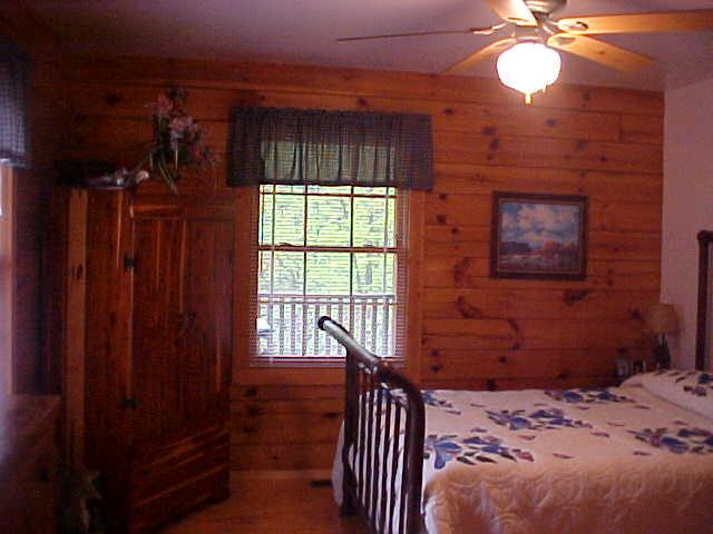 1235 Villamont Church Road Blue Ridge, VA 24064 - Photo 6 of 8 a bedroom with a bed and a window