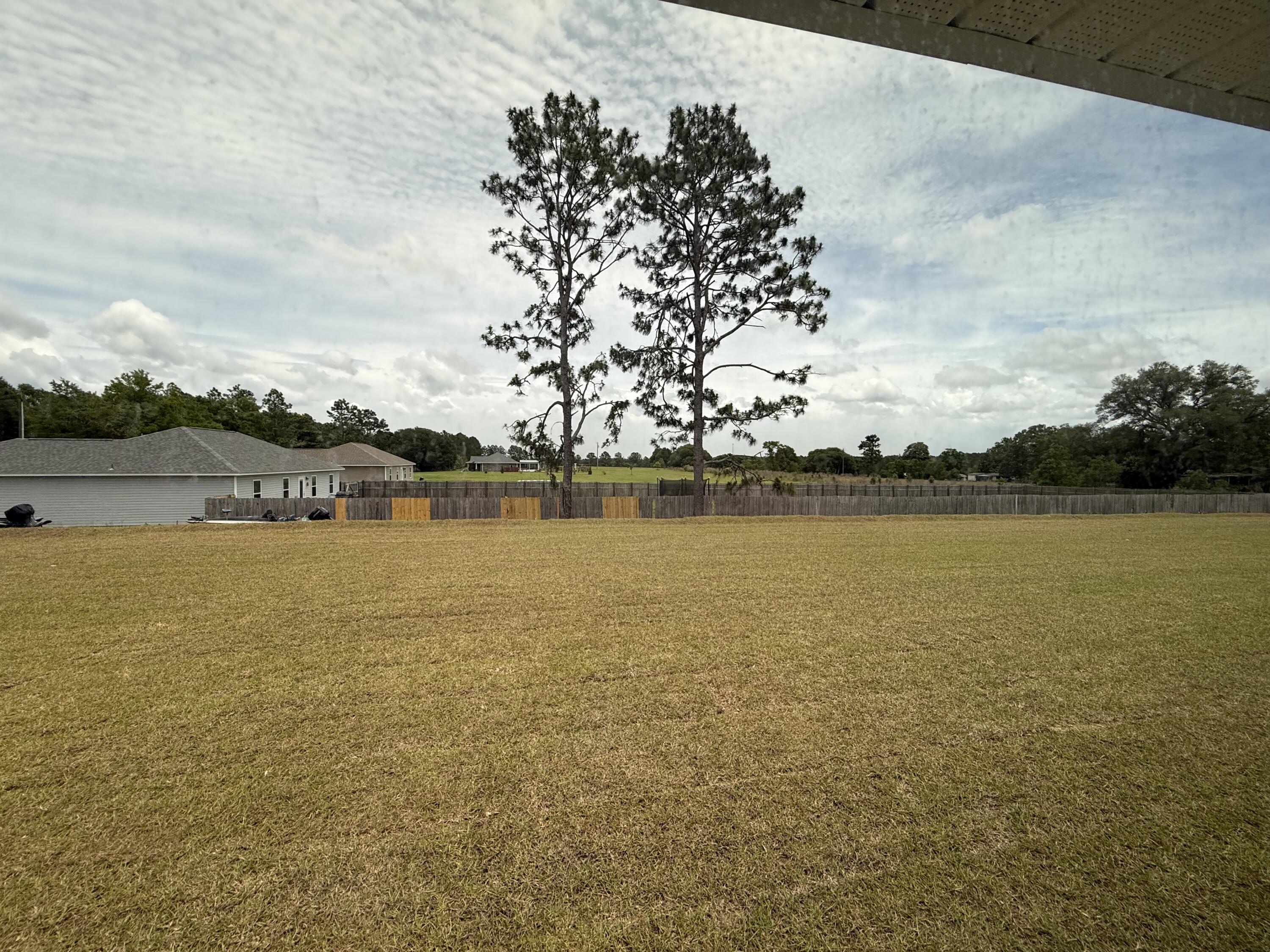 6002 Crocket Cove Crestview, FL 32539 - Photo 29 of 29 a view of an ocean with beach