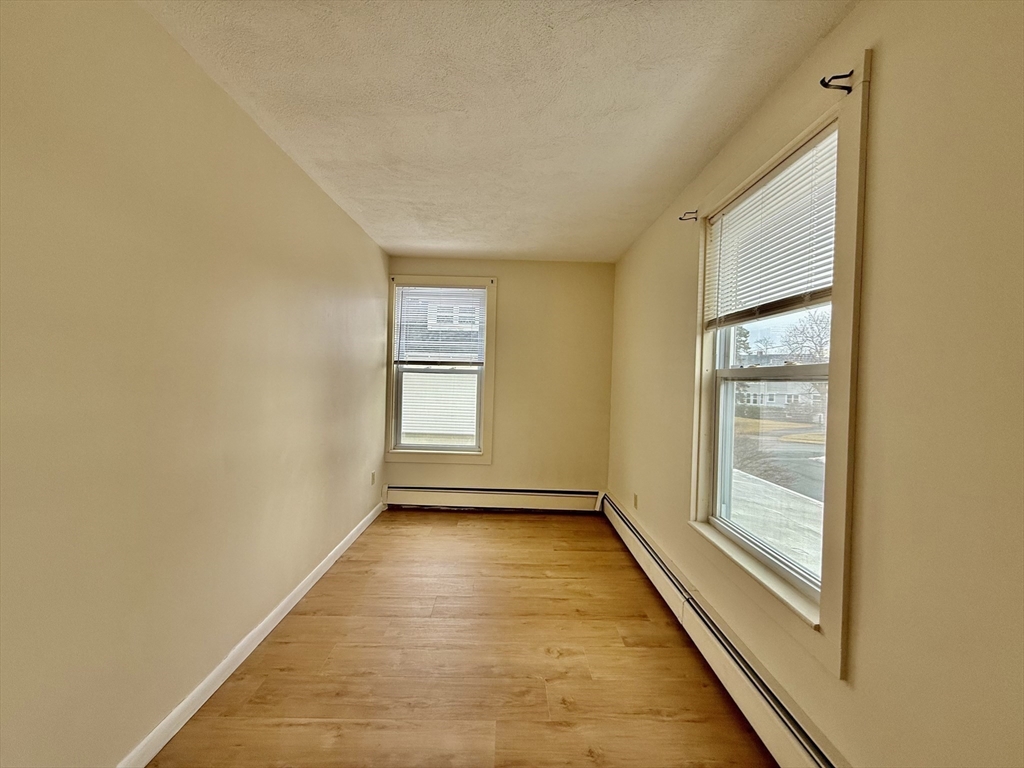 17 Maple Street, Unit 2 Braintree, MA 02184 - Photo 11 of 25 a view of an empty room and window