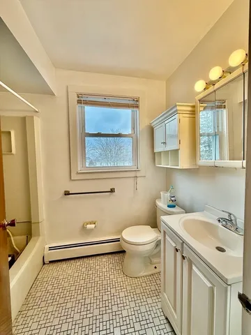 a view of a house with a wooden deck