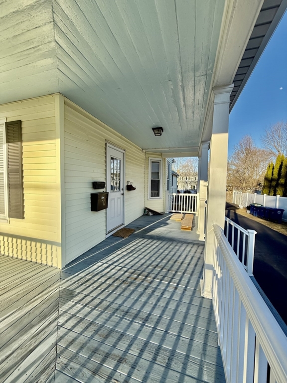 17 Maple Street, Unit 2 Braintree, MA 02184 - Photo 20 of 25 a spacious bedroom with wooden floor
