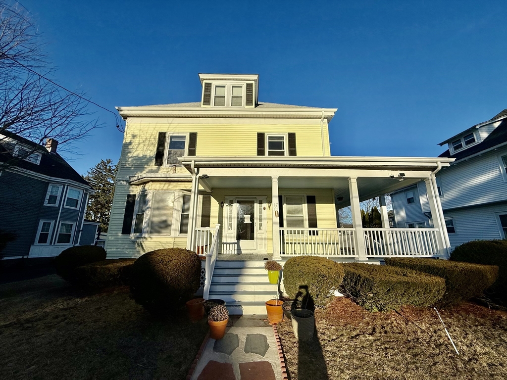 17 Maple Street, Unit 2 Braintree, MA 02184 - Photo 22 of 25 a front view of a house with a yard