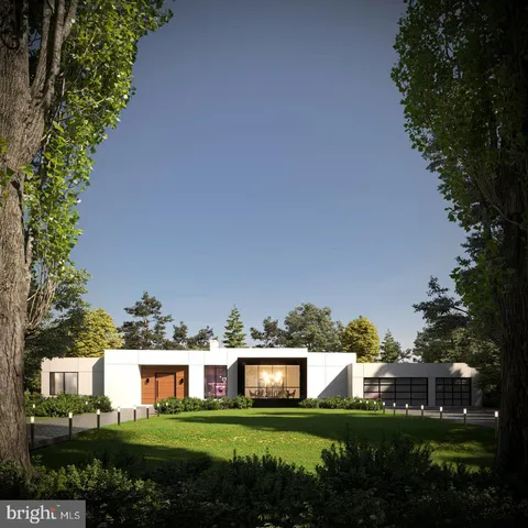 a view of a house with a big yard and large trees