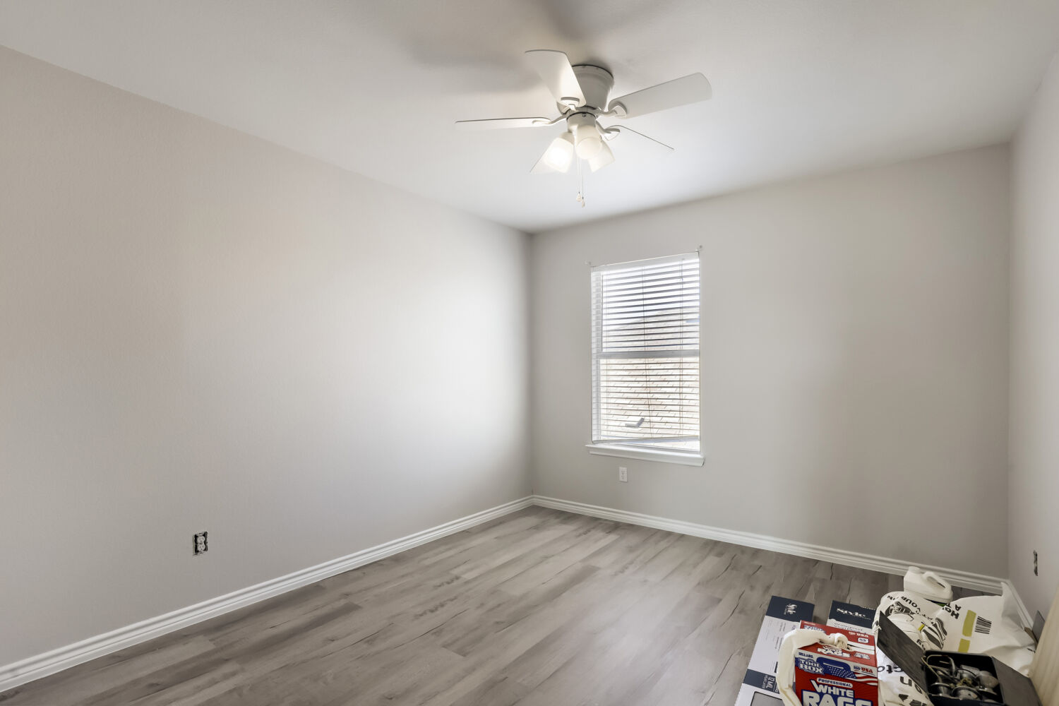 153 Marcheeta Way Leander, TX 78641 - Photo 11 of 17 Smooth wood-look flooring and a single window define this versatile secondary room.