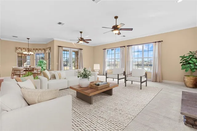 a living room with furniture and a large window