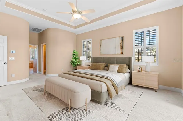 a bedroom with a large bed and a chandelier