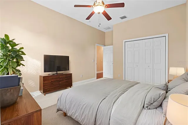 a bathroom with a granite countertop sink a toilet and bathtub