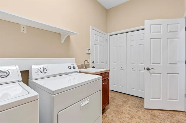 a balcony with chairs and a table