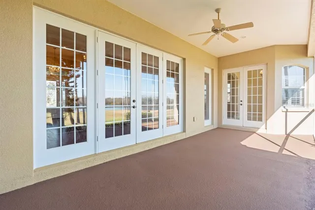 a view of a swimming pool with an outdoor space and seating area