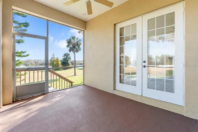 a view of a big yard with an trees in the background