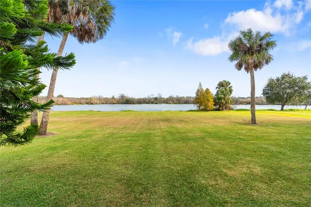 a view of a swimming pool with an outdoor space and seating area