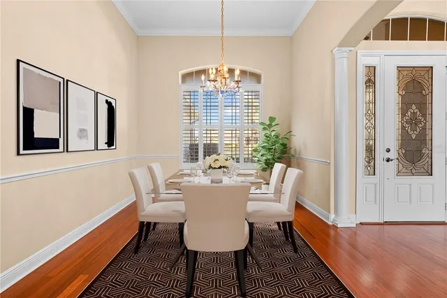 a view of a dining room with furniture window and wooden floor