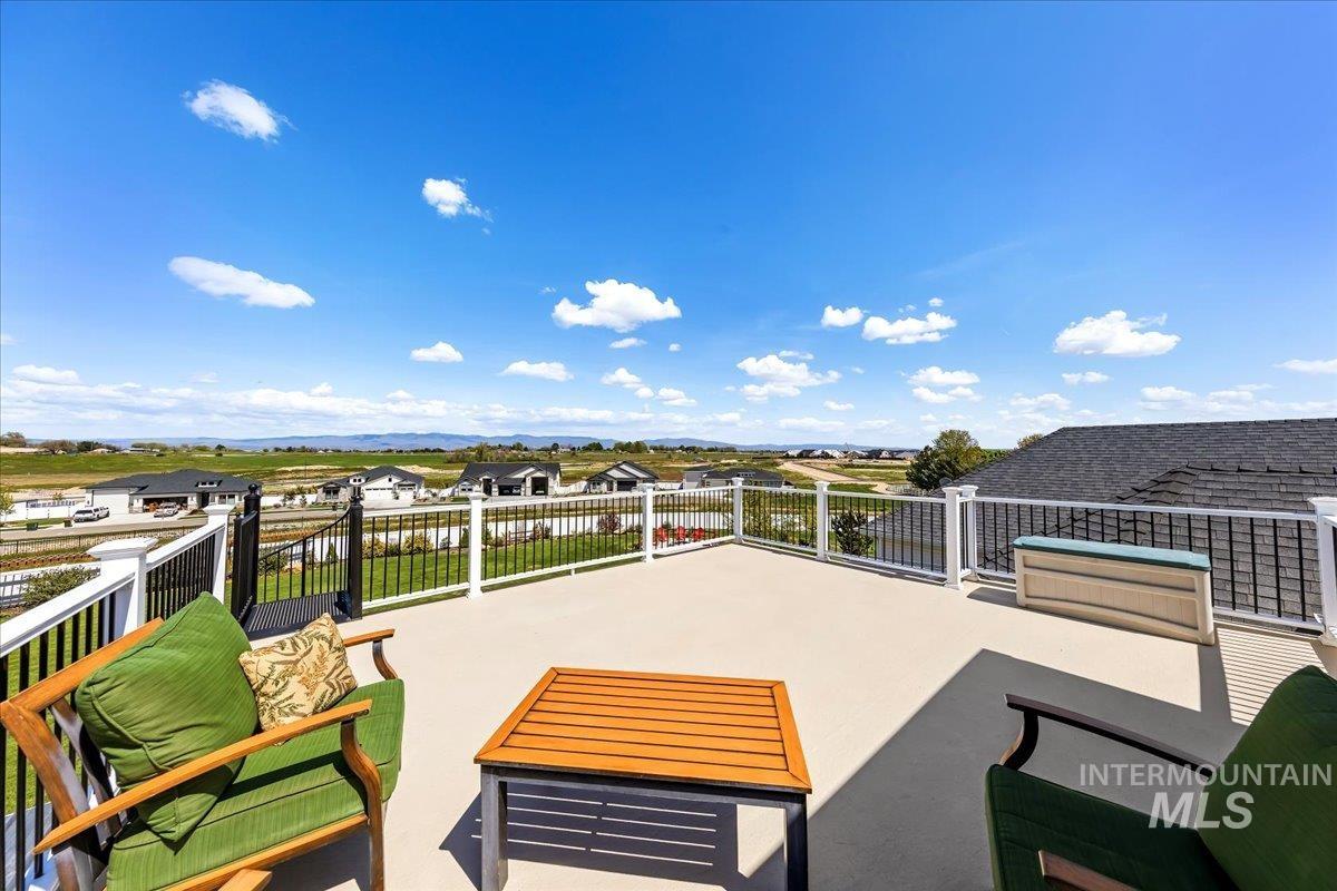 414 East Shafer View Drive Meridian, ID 83642 - Photo 35 of 50 Expansive 20x20 outdoor deck off the upstairs Bonus Room has sturdy white railings, a spiral staircase to the lower lvl patio. Unwind as you watch the sunset & super fun for watching the Fireworks on 4th of July View the entire Treasure Valley skyline!