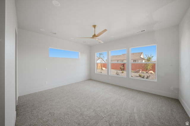 3011 East Rimrunner Drive, Unit 302 St. George, UT 84790 - Photo 19 of 45 Empty room featuring light carpet and a ceiling fan
