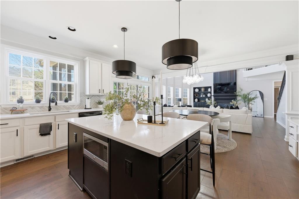 3173 Abbey Place Southwest Atlanta, GA 30331 - Photo 17 of 56 a kitchen with stainless steel appliances granite countertop a sink a stove and a refrigerator