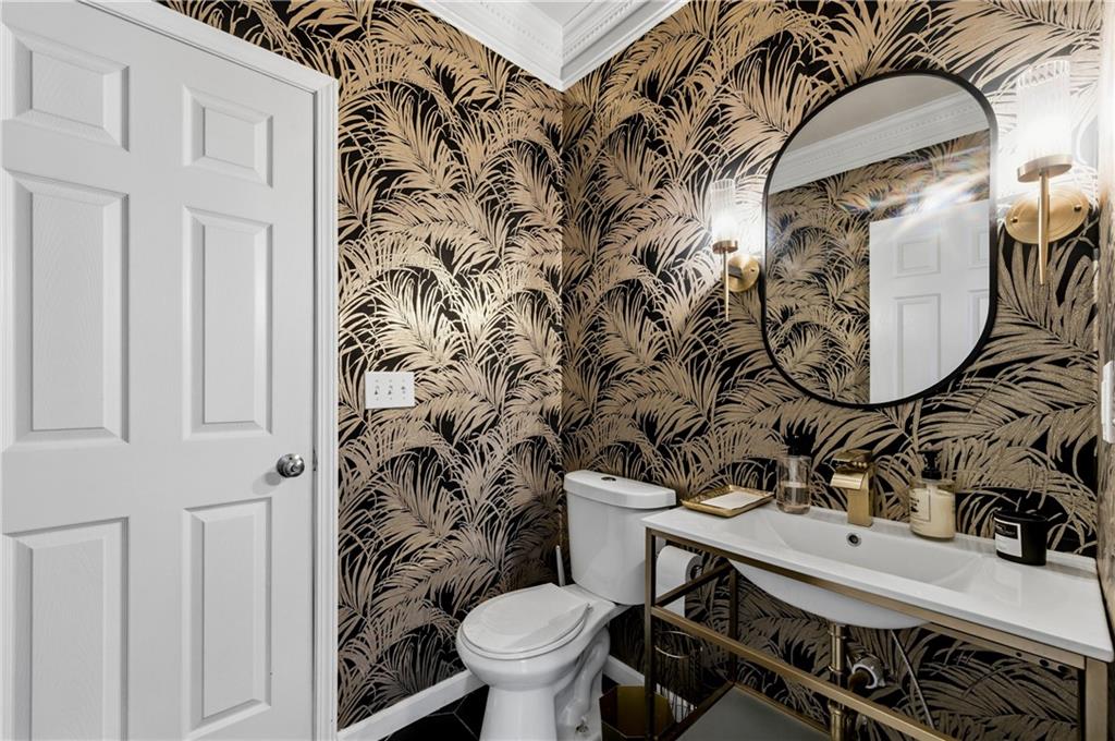 3173 Abbey Place Southwest Atlanta, GA 30331 - Photo 22 of 56 a bathroom with a sink a toilet and a mirror