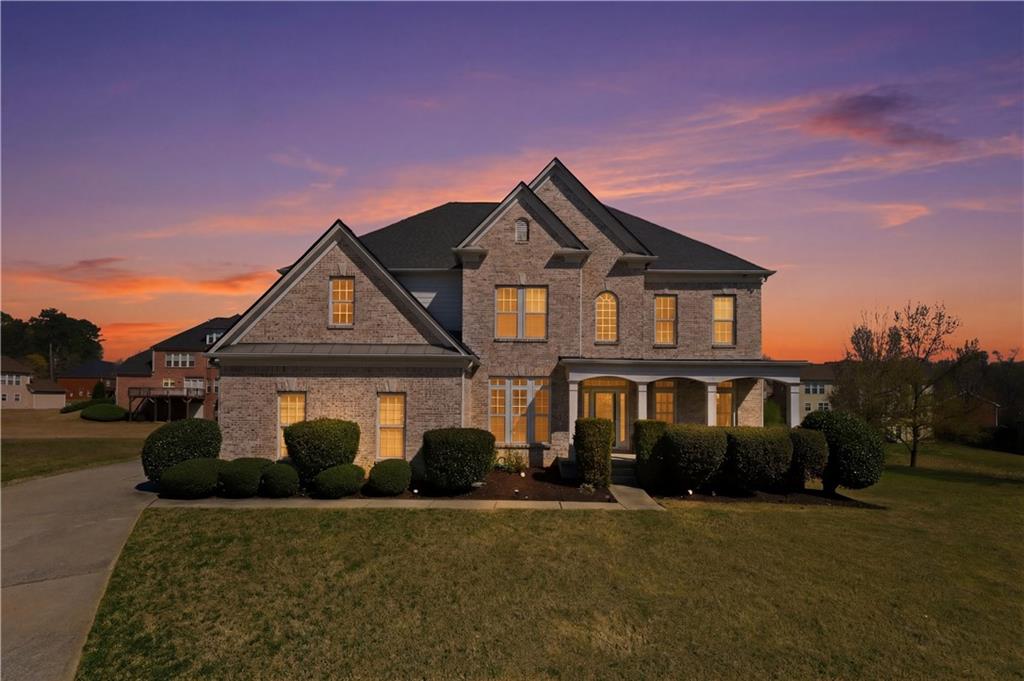 3173 Abbey Place Southwest Atlanta, GA 30331 - Photo 3 of 56 a front view of a house with garden