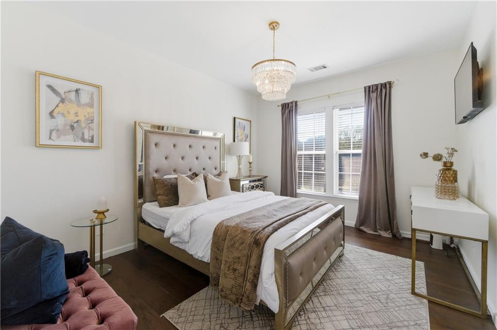 3173 Abbey Place Southwest Atlanta, GA 30331 - Photo 33 of 56 a bedroom with a bed and a table in it