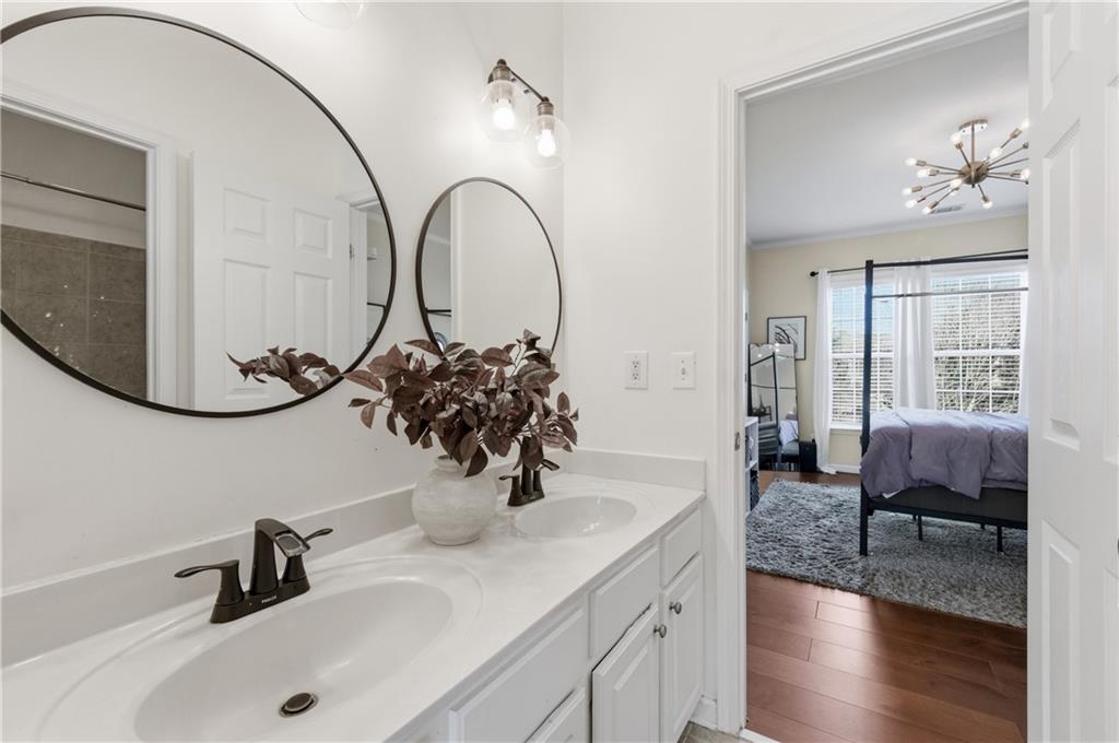 3173 Abbey Place Southwest Atlanta, GA 30331 - Photo 36 of 56 a bathroom with a double vanity sink and a mirror