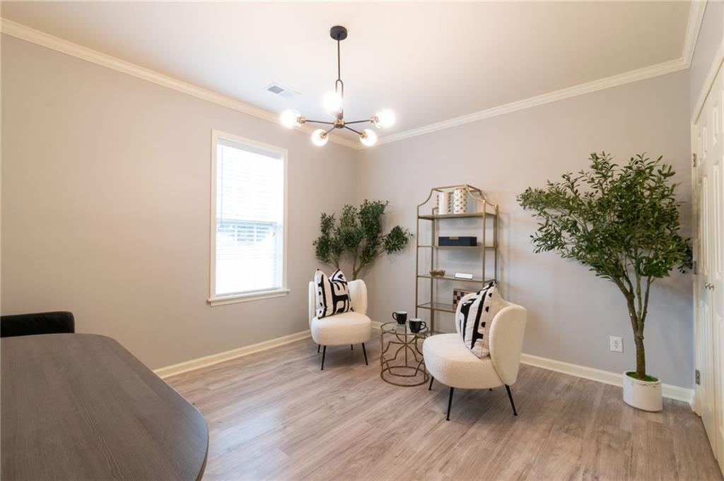 3173 Abbey Place Southwest Atlanta, GA 30331 - Photo 44 of 56 a living room with furniture and a potted plant