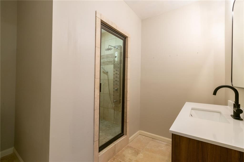 3173 Abbey Place Southwest Atlanta, GA 30331 - Photo 45 of 56 a bathroom with a sink and mirror