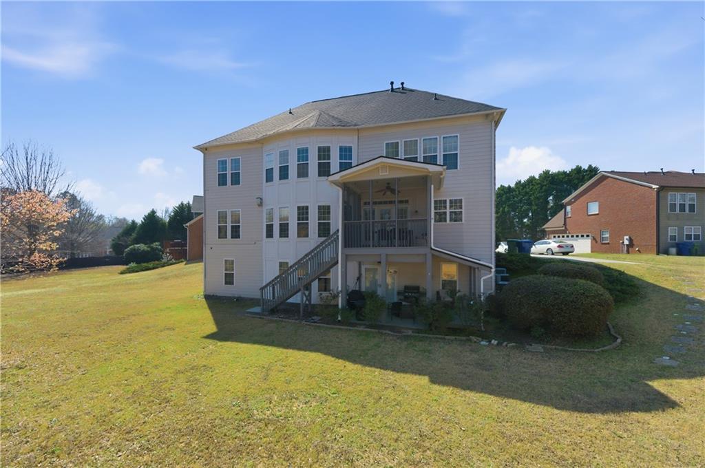 3173 Abbey Place Southwest Atlanta, GA 30331 - Photo 48 of 56 a front view of a house with a yard