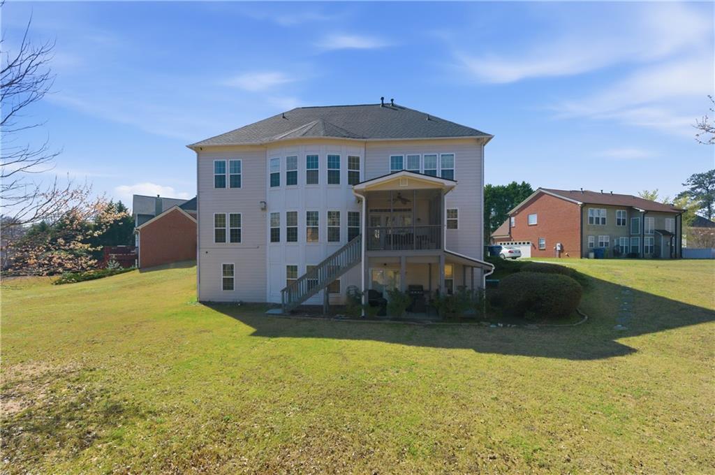 3173 Abbey Place Southwest Atlanta, GA 30331 - Photo 49 of 56 a front view of a house with a yard