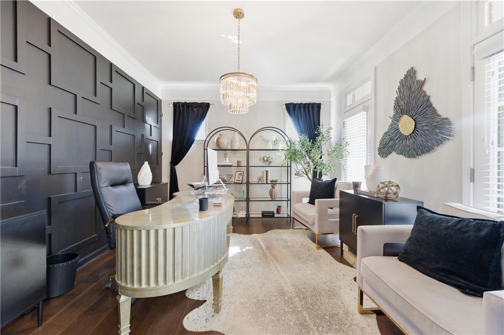 3173 Abbey Place Southwest Atlanta, GA 30331 - Photo 7 of 56 a living room with furniture a rug and a chandelier